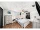 Comfortable bedroom features wood-look floors, a ceiling fan and double hung window for natural light at 3422 Trask Dr, Holiday, FL 34691