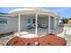 Inviting front porch with cozy seating and landscaping provides a relaxing space to enjoy the outdoors at 3422 Trask Dr, Holiday, FL 34691