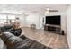 Spacious living room with ceiling fans and tile floors at 3422 Trask Dr, Holiday, FL 34691