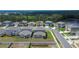 An aerial view of neatly arranged homes in a modern residential neighborhood, showcasing the well-maintained lawns at 34780 Rainville Loop, Zephyrhills, FL 33541