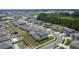 Aerial view of a lovely neighborhood showcasing green lawns, well-maintained homes, and manicured landscaping at 34780 Rainville Loop, Zephyrhills, FL 33541