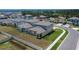 Aerial view of the home's backyard with a well-maintained lawn and a garden at 34780 Rainville Loop, Zephyrhills, FL 33541