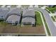 Aerial view of the backyard featuring a fence and lush grass, ideal for outdoor enjoyment at 34780 Rainville Loop, Zephyrhills, FL 33541