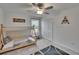 bedroom featuring a teepee bed, area rug, window, and ceiling fan at 34780 Rainville Loop, Zephyrhills, FL 33541