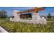 Beautiful stone sign and wood accents marking the entrance to the Childers community at 34780 Rainville Loop, Zephyrhills, FL 33541