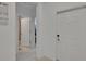Bright entryway featuring tile floors and neutral paint, leading to other rooms at 34780 Rainville Loop, Zephyrhills, FL 33541