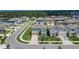 An aerial view of a two-story home featuring a well-maintained lawn and attached garage at 34780 Rainville Loop, Zephyrhills, FL 33541