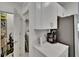 Convenient kitchen area featuring a laundry area with appliances, storage, and counter space at 34780 Rainville Loop, Zephyrhills, FL 33541