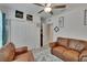 Inviting living room with neutral decor, a closet, and cozy seating, perfect for relaxation at 34780 Rainville Loop, Zephyrhills, FL 33541