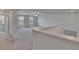 Spacious living room with carpet floors and natural light at 34780 Rainville Loop, Zephyrhills, FL 33541