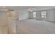 Spacious living room with carpet floors at 34780 Rainville Loop, Zephyrhills, FL 33541