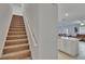 Carpet staircase next to the kitchen at 34780 Rainville Loop, Zephyrhills, FL 33541