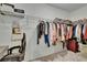 Walk-in closet with an open shelf and carpet floors at 34780 Rainville Loop, Zephyrhills, FL 33541