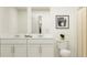 Bright bathroom featuring double vanity, neutral tones, and decorative accents at 36046 Risa Michele St, Zephyrhills, FL 33541