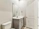 Bathroom featuring a single vanity, toilet, and neutral finishes at 3764 Laughing Dove Ave, Sun City Center, FL 33573
