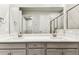 Bathroom featuring a double vanity, and view into the walk-in closet and shower at 3764 Laughing Dove Ave, Sun City Center, FL 33573