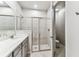 Bathroom featuring a single vanity, frameless shower, toilet, and neutral finishes at 3764 Laughing Dove Ave, Sun City Center, FL 33573