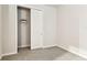 Cozy bedroom with neutral carpet and an open closet for easy storage solutions at 3764 Laughing Dove Ave, Sun City Center, FL 33573