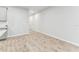 Hallway features wood-style tile flooring and neutral wall at 3764 Laughing Dove Ave, Sun City Center, FL 33573
