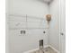 Laundry Room featuring tile floor, utility sink, and wire shelving at 3764 Laughing Dove Ave, Sun City Center, FL 33573