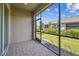 Cozy screened-in patio with brick flooring, perfect for outdoor relaxation and entertaining at 3764 Laughing Dove Ave, Sun City Center, FL 33573