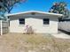 Spacious backyard framed by a mix of wooden and white fencing at 3851 72Nd N St, St Petersburg, FL 33709