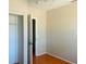 A bedroom features a sliding closet door and a view to the hallway at 3851 72Nd N St, St Petersburg, FL 33709