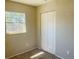 Bright bedroom features bifold closet and natural light streaming through large window at 3851 72Nd N St, St Petersburg, FL 33709