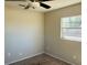 Bedroom featuring neutral walls, carpet floors, ceiling fan and a sunny window at 3851 72Nd N St, St Petersburg, FL 33709
