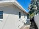 Rear exterior featuring horizontal siding and partial fencing at 3851 72Nd N St, St Petersburg, FL 33709