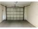 A garage door with horizontal panels and a garage door opener at 3851 72Nd N St, St Petersburg, FL 33709