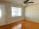Inviting living room with bright window and ceiling fan at 3851 72Nd N St, St Petersburg, FL 33709