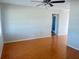 Open living room with wood floors, neutral walls, and ceiling fan at 3851 72Nd N St, St Petersburg, FL 33709