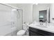 Bathroom featuring shower, glass door, vanity, sink, faucet, toilet and mirror at 3952 Bonfire Dr, Odessa, FL 33556