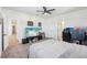 Comfortable bedroom features a ceiling fan, and doorway access to the hallway at 3952 Bonfire Dr, Odessa, FL 33556