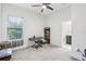 Bright bedroom with ceiling fan, window, carpet, and closet; perfect for relaxation and rest at 3952 Bonfire Dr, Odessa, FL 33556