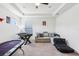 Bonus room featuring a foosball table, sectional couch and a comfortable beanbag chair at 3952 Bonfire Dr, Odessa, FL 33556