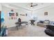 Spacious bonus room with foosball table, sofa, ceiling fan and plenty of space for entertainment at 3952 Bonfire Dr, Odessa, FL 33556