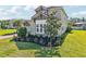 Attractive exterior of a two-story home with lush landscaping and a well-kept lawn at 3952 Bonfire Dr, Odessa, FL 33556