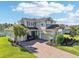 Stunning two-story home featuring a paver driveway and beautiful landscaping at 3952 Bonfire Dr, Odessa, FL 33556
