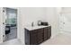 Hallway features a desk with drawers and granite countertop, perfect for a home office at 3952 Bonfire Dr, Odessa, FL 33556