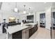 Spacious kitchen with a large island, stainless steel appliances, and an open floor plan at 3952 Bonfire Dr, Odessa, FL 33556