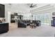 Spacious living room with an open floor plan, seamlessly connecting to the kitchen and dining area at 3952 Bonfire Dr, Odessa, FL 33556