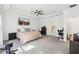Large main bedroom offers a ceiling fan, tray ceiling, and access to the ensuite bath at 3952 Bonfire Dr, Odessa, FL 33556