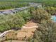 Aerial view showcases a playground with a swing set and climbing structures in a new community at 3952 Bonfire Dr, Odessa, FL 33556