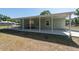 Exterior shot of the back porch and house, showing the covered area at 4416 Tevalo Dr, Valrico, FL 33596
