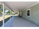 Exterior shot of the back porch and house, showing the covered patio at 4416 Tevalo Dr, Valrico, FL 33596