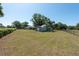 View of the large backyard featuring a shed, green grass and a fenced in perimeter at 4416 Tevalo Dr, Valrico, FL 33596