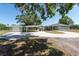 The home's exterior features a detached garage, covered parking and a concrete driveway at 4416 Tevalo Dr, Valrico, FL 33596