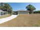Home's exterior featuring a covered carport and nice landscaping at 4416 Tevalo Dr, Valrico, FL 33596